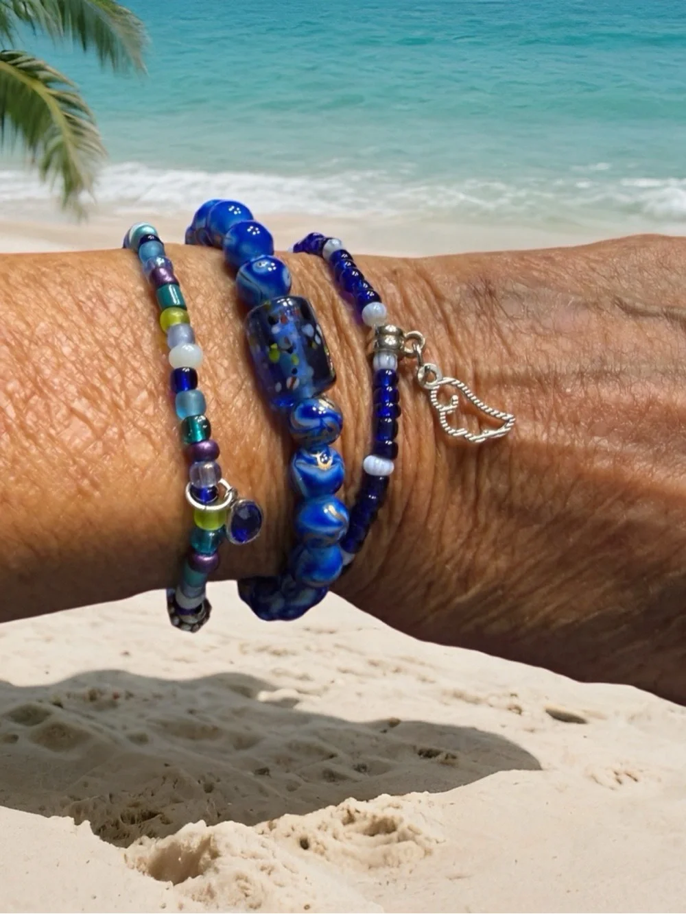 Hand Crafted Blue Glass Bead Trio Bracelet Set with Silver Wing Charm